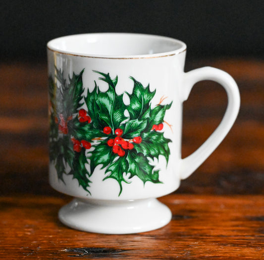 white mug with gold rim and pointsettia print