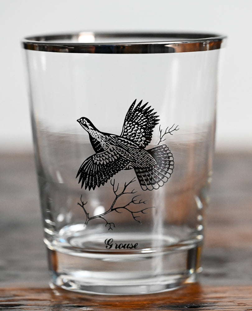 grouse on double old fashioned glass with silver rim