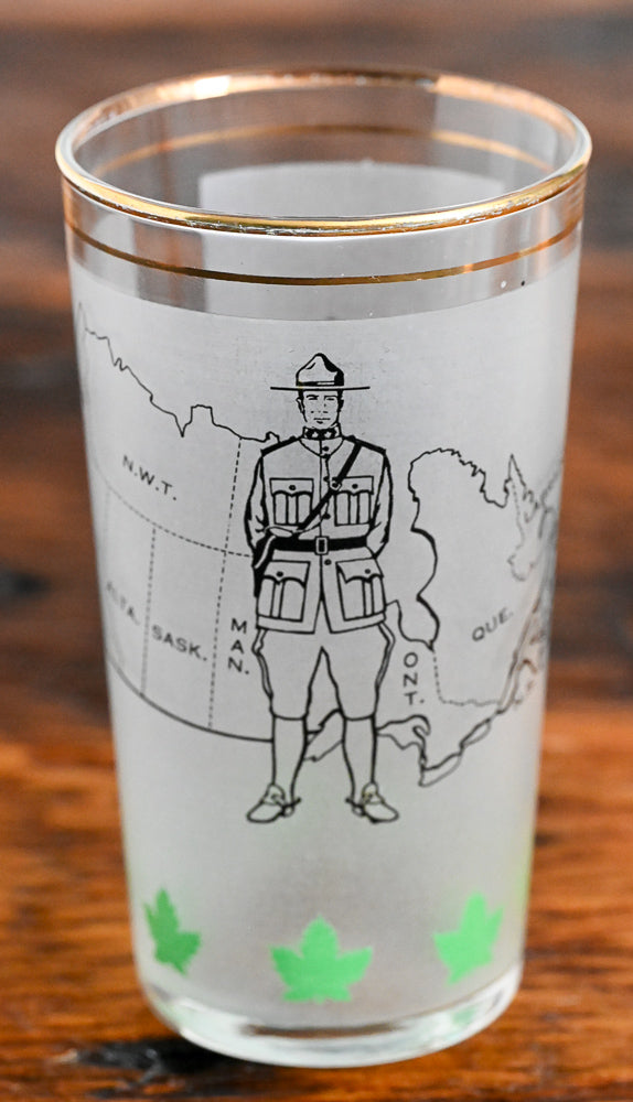 frosted tumbler with Candian Mountie and Canada Map
