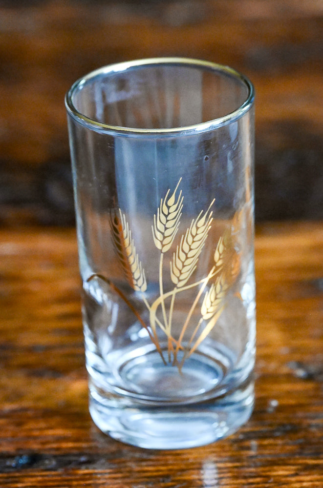 golden wheat and rimmed juice glass