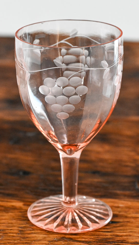 pink wine glass etched with grapes