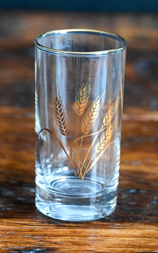 golden wheat and rimmed juice glass
