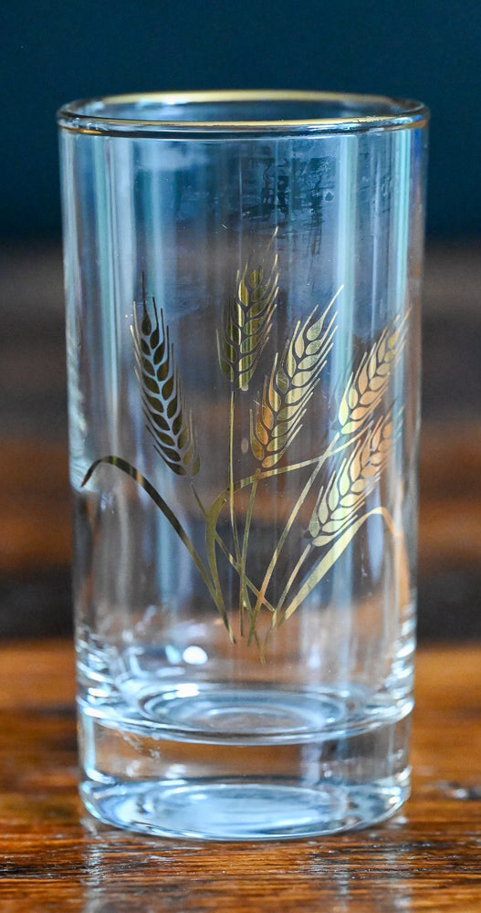 golden wheat and rimmed juice glass