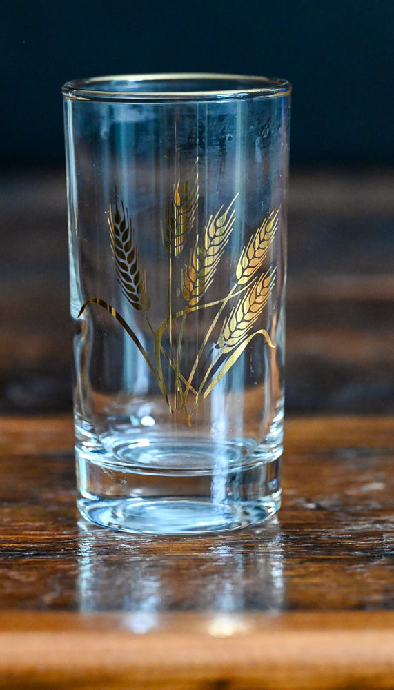 golden wheat and rimmed juice glass
