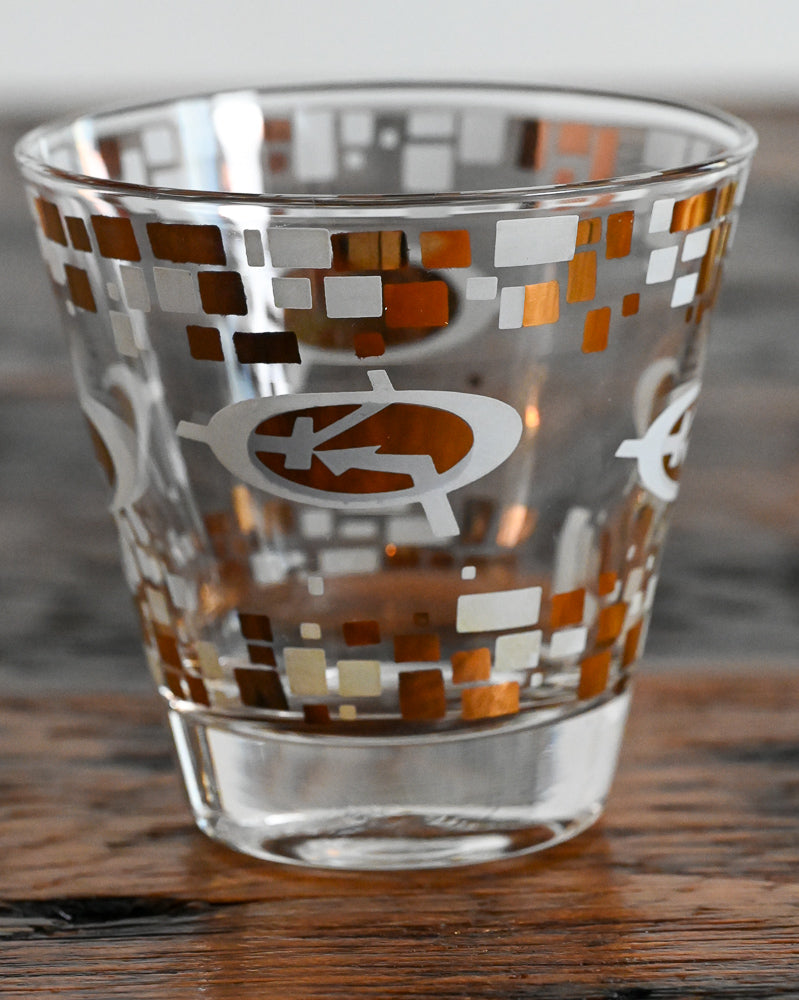 gold and white MCM logo double rocks glasses