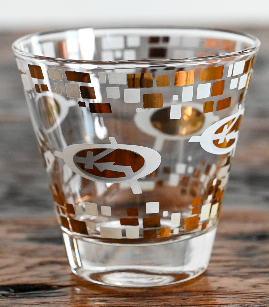 gold and white MCM logo double rocks glasses
