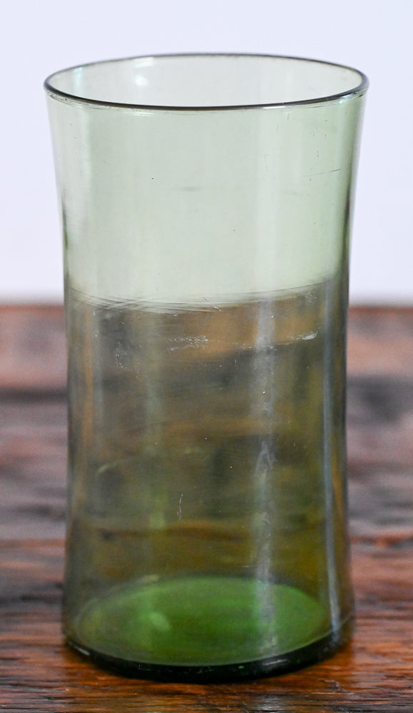 green curved tumbler glass