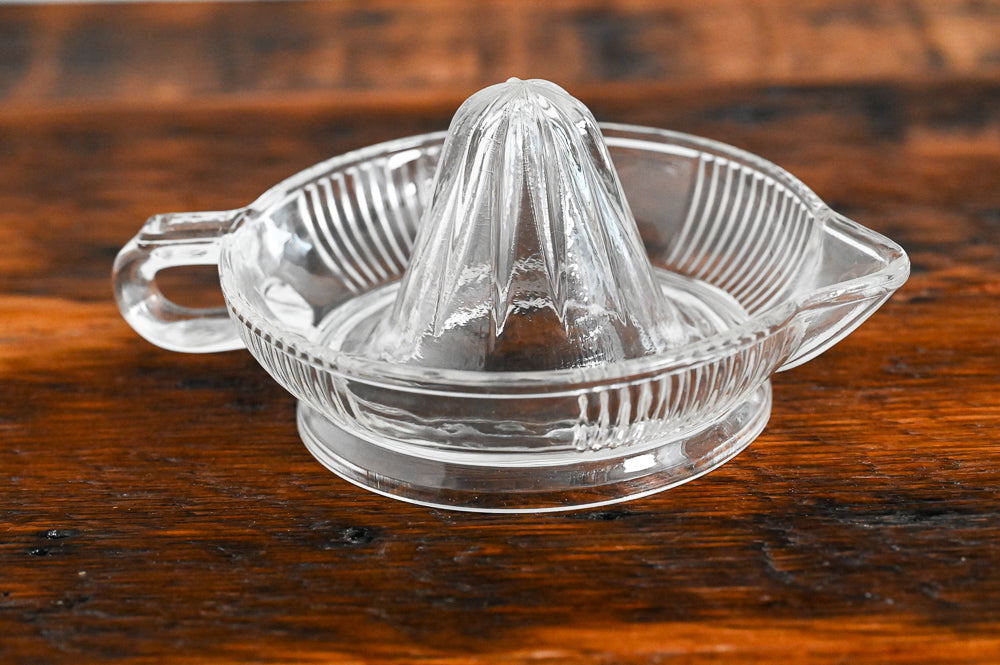 clear glass citrus reamer with ribbing on sides