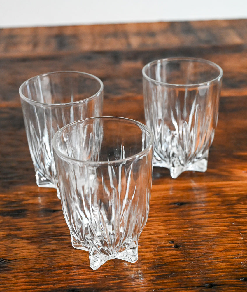 glasses with small feet on wood table