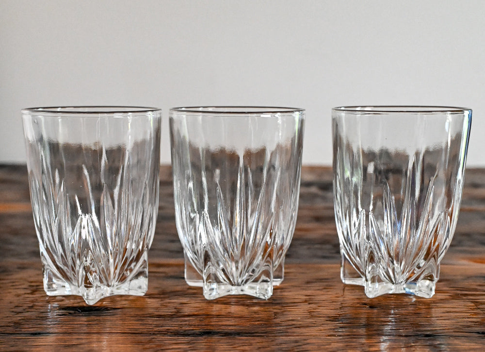 glasses with small feet on wood table