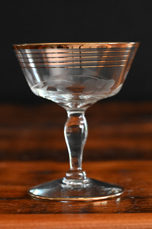 gold rim and gold striped flower etched cocktail coupes