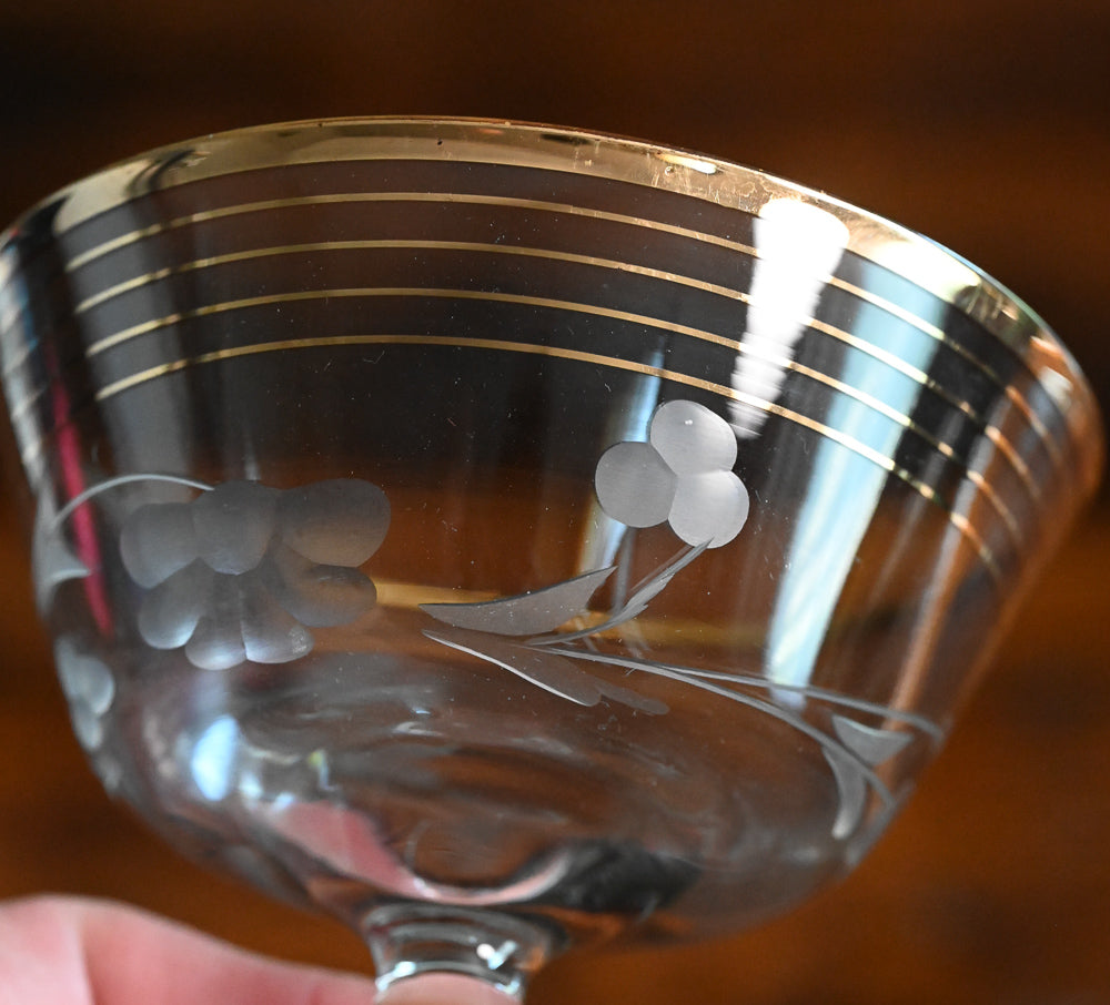 gold rim and gold striped flower etched cocktail coupes