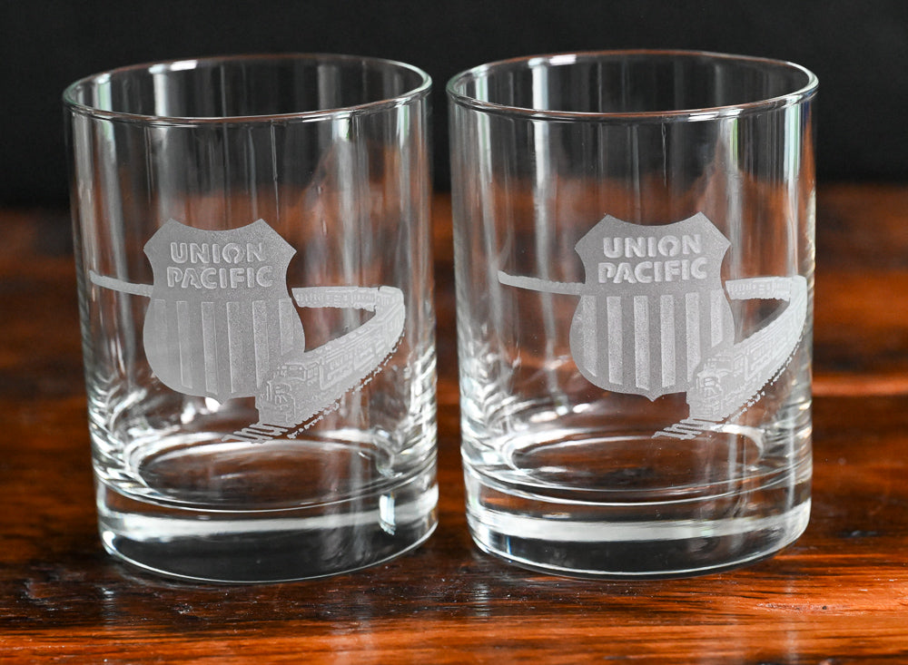 etched Union Pacific Railroad logo and train on clear rocks glass