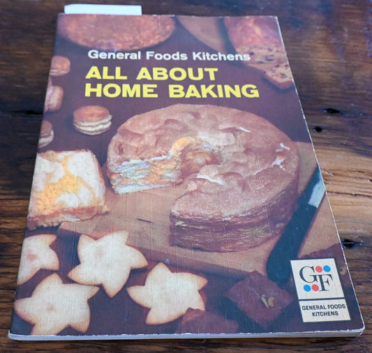 cover of all about home baking cookbook with cake and cookies